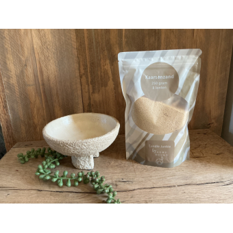 Stoere schaal met zak kaarsenzand